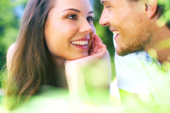 Attractive young couple gazing into each others eyes